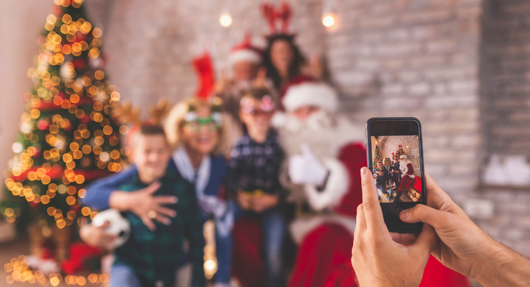A family taking a photo with Santa.
