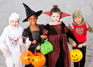 Children wearing Halloween costumes.