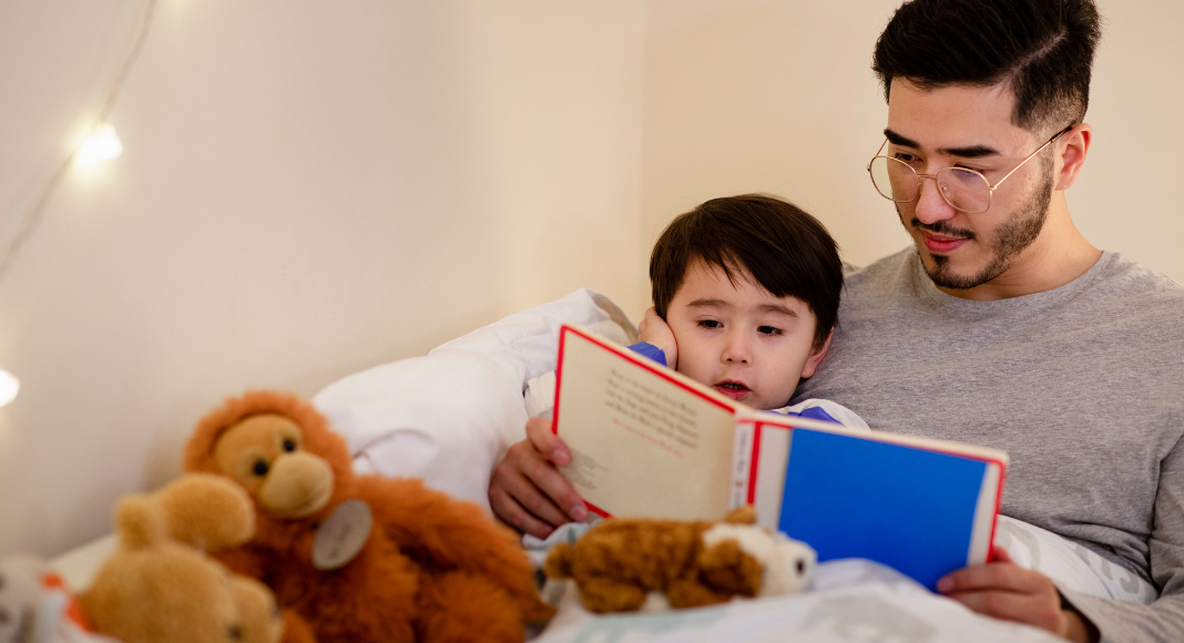 A dad reading a bedtime story.