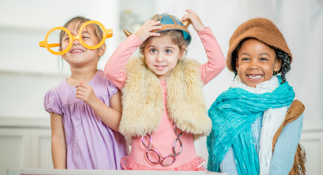 Kids playing dress-up during a play date. 